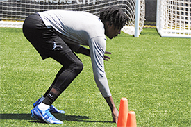 Deron works on his lateral movement from a three-point stance.