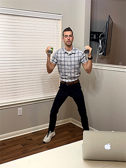 CHLN instructor exercising in front of a laptop.