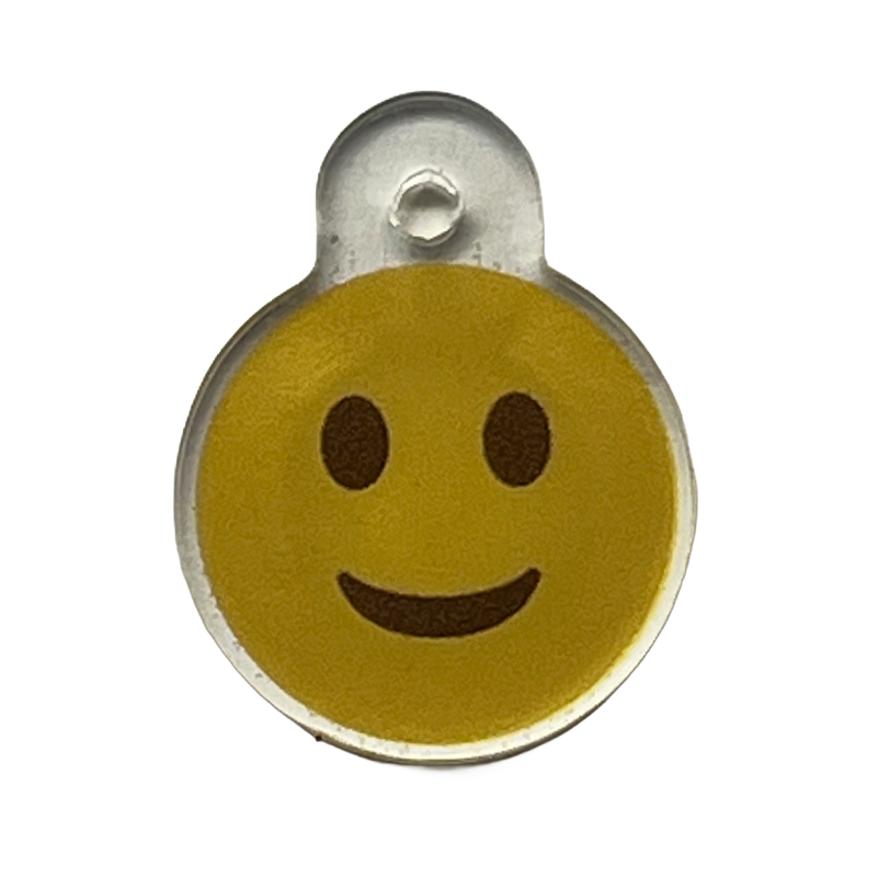 Acrylic charm with a yellow smiley face icon.