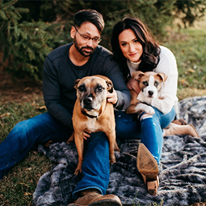 Brittany Rospierski, her fiancé, and their two dogs, Boone and Rosie, on their farm.