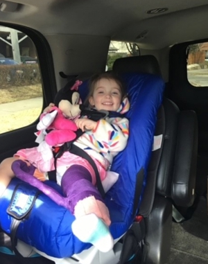 ella in car seat with hip cast