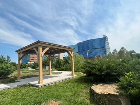 A small wooden shelter in the Children's Mercy Community Garden