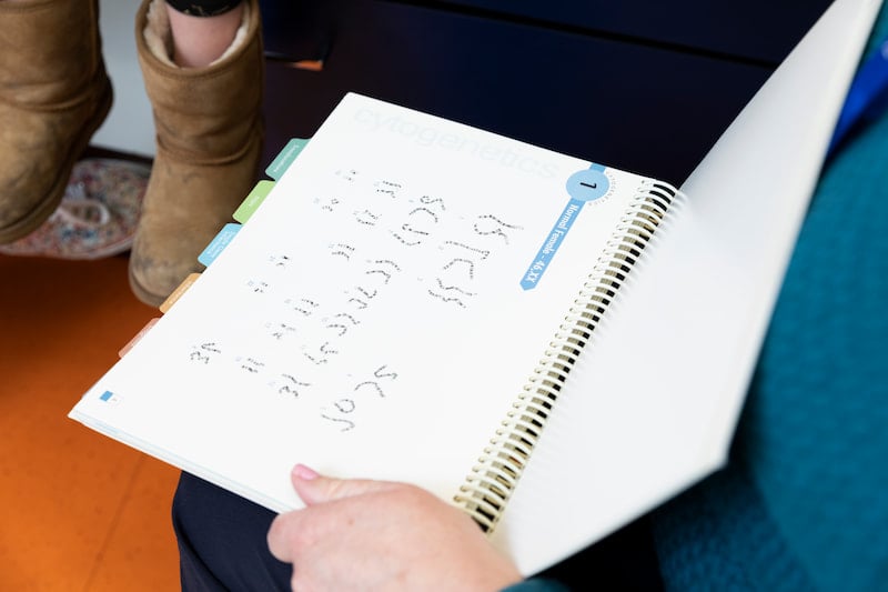 An image of chromosomes is shown to a patient in the Children's Mercy Genetics Clinic.