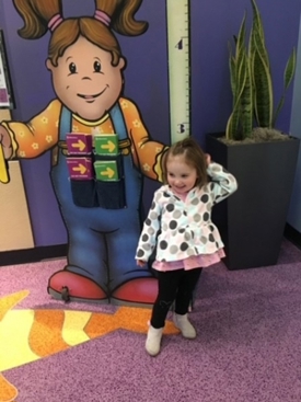 ella standing in clinic hallway