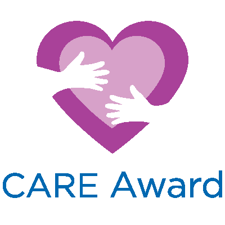 White cartoon hands hug a purple heart. Text reads: CARE Award