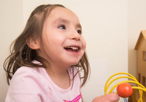 A child at Children's Mercy talks with a physician from the Developmental and Behavioral Sciences team.