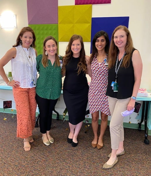 Five women stand together at the Pediatric Hematology Oncology Fellowship graduation.