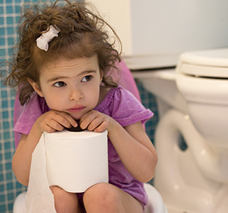 Child on the street learning to potty train