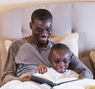 Dad reading to child