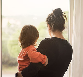 Mom and child looking out the window