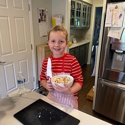 Julianne loves cooking shows and both real and play kitchens!