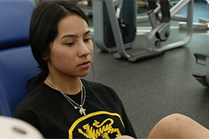 Torn ACL patient, Nahomi, in gym