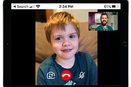 TJ having a telemedicine visit with Dr. John Rosen