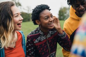 Teen girl laughing with friends