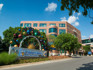 Picture of the front entrance of Children's Mercy hospital with the words My trip to the Audiologist above the building